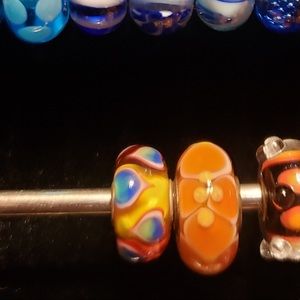 Two orange Trollbeads
